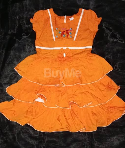 KIDS ORANGE FROCK DESIGN