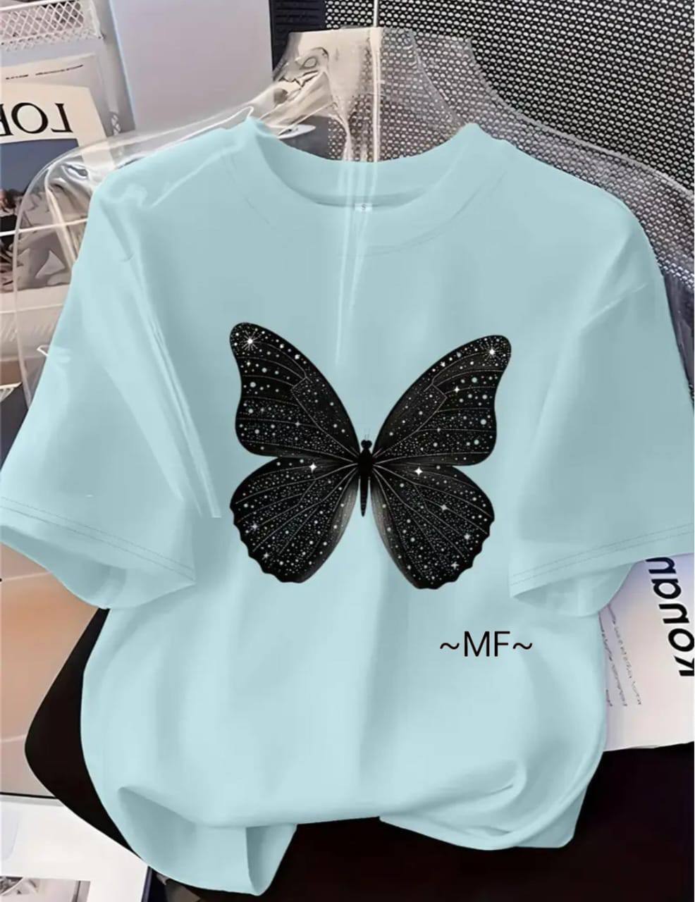 LIGHT BLUE TEE WITH A BLACK BUTTERFLY PRINT